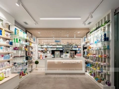White Linear Pharmacy Aisle Shelving and Back Counter