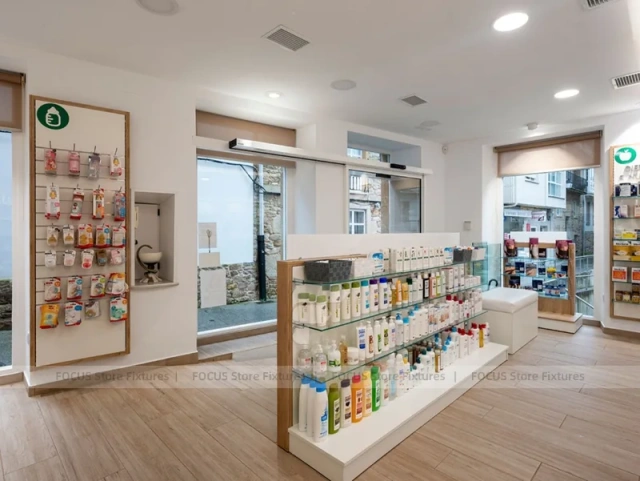 White Linear Pharmacy Aisle Shelving and Back Counter