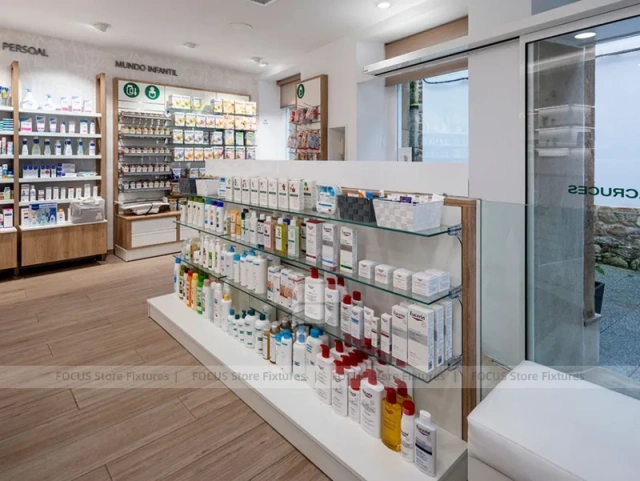 White Linear Pharmacy Aisle Shelving and Back Counter