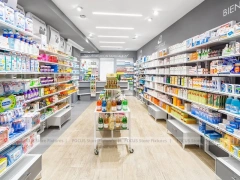 White Linear Pharmacy Wall Shelving Layout