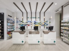 White Pharmacy Checkout Counter and Wall Shelving