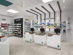 White Pharmacy Checkout Counter and Wall Shelving