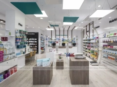 White Pharmacy Checkout Counter with Black Signage Wall