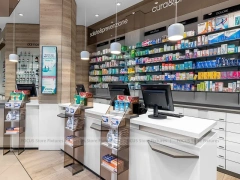 White Pharmacy Checkout Counter with Central Gondola Display