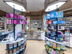 White Pharmacy Checkout Counter with Central Gondola Display