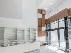 White Pharmacy Interior with Wood Reception Wall