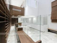 White Pharmacy Interior with Wood Reception Wall