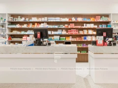 White Pharmacy Reception Counter with Dark Wall Shelves