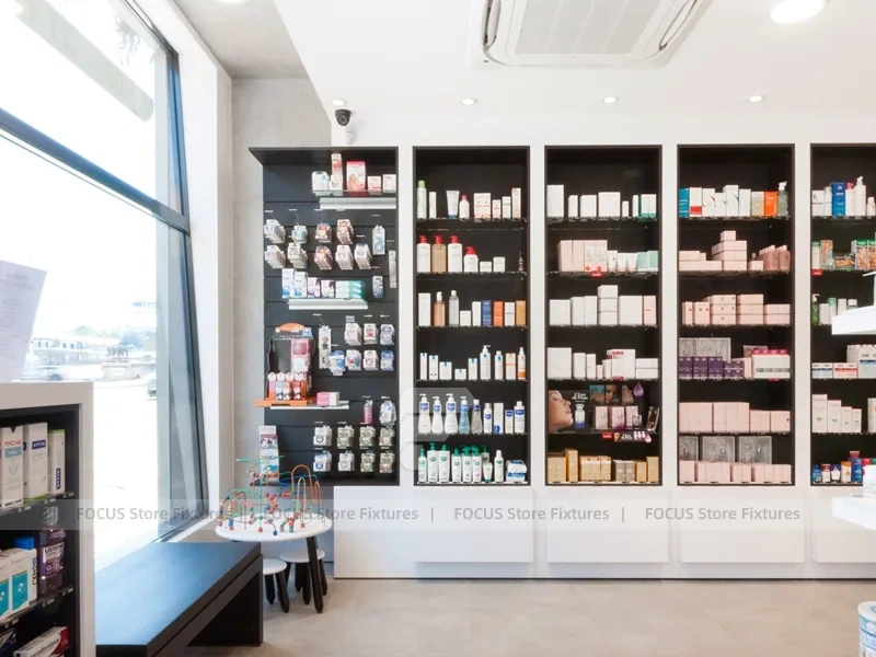 White Pharmacy Reception Counter with Dark Wall Shelves