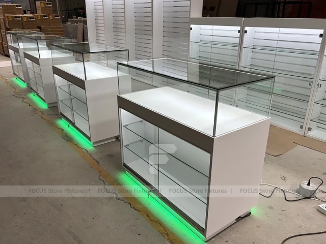 Long White Mobile Phone Counter With Green Lighting