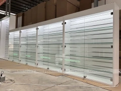 Long White Mobile Phone Counter With Green Lighting