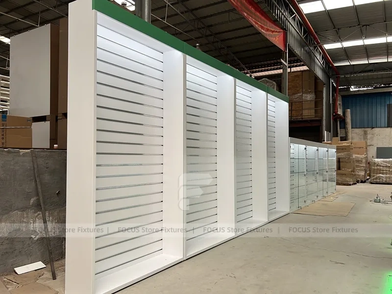 Long White Mobile Phone Counter With Green Lighting