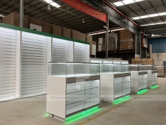Long White Mobile Phone Counter With Green Lighting