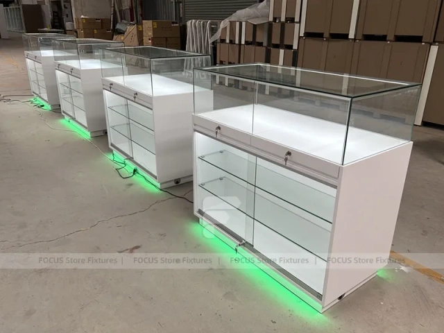 Long White Mobile Phone Counter With Green Lighting