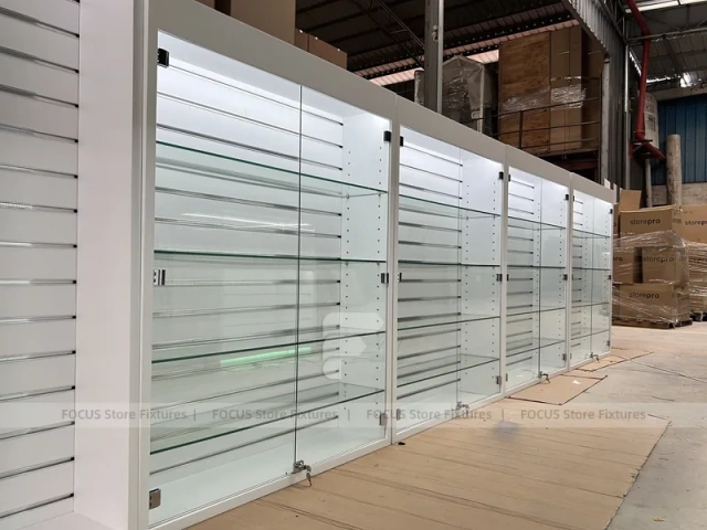 Long White Mobile Phone Counter With Green Lighting
