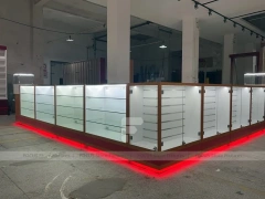 White Glass Kiosk Counter With Red LED Base