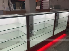White Glass Kiosk Counter With Red LED Base