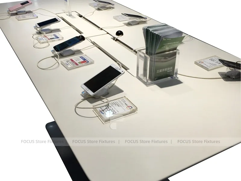 White Phone Demo Table With Charging Slots