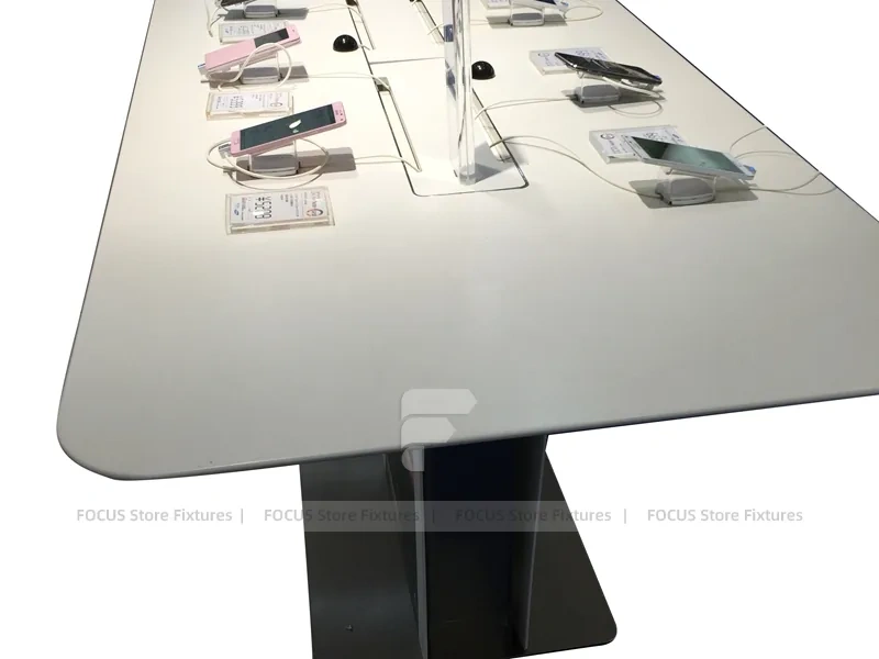 White Phone Demo Table With Charging Slots
