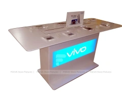 White Phone Demo Table With Charging Slots