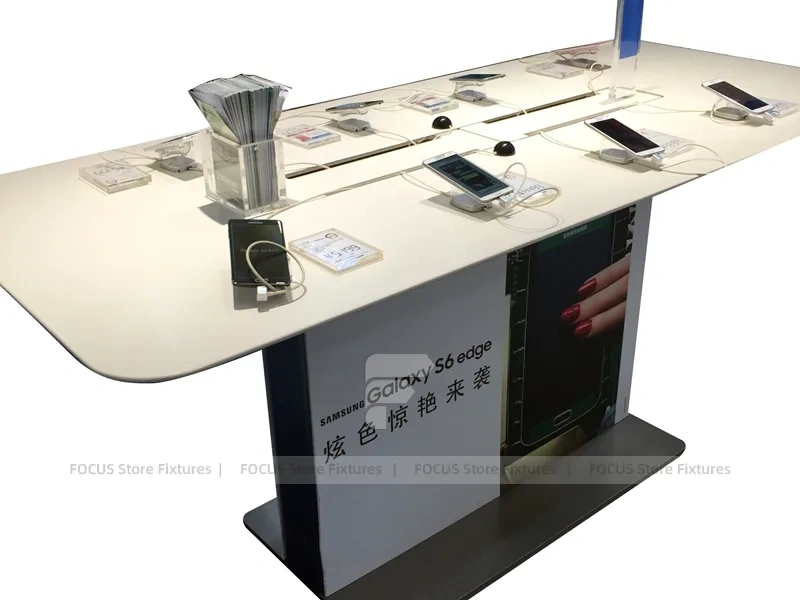 White Phone Demo Table With Charging Slots