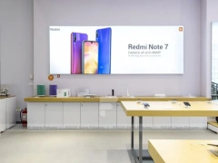 White Redmi Phone Display Wall And Table