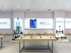 White Redmi Phone Display Wall And Table