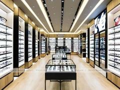 Black Frame Eyewear Display Hall with Central Demo Tables