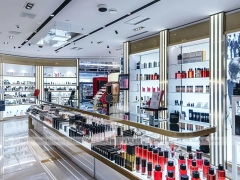 Bright Perfume Aisle Layout With Gold Trim