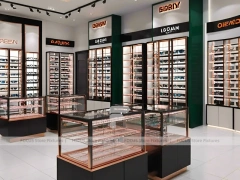 Charcoal Copper Eyewear Retail Interior with Copper-Framed Cases