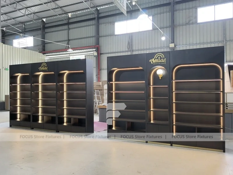 Dark Perfume Wall Shelving With Gold Arch Frames
