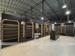 Dark Perfume Wall Shelving With Gold Arch Frames