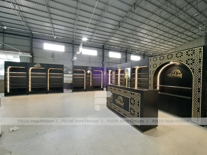 Dark Perfume Wall Shelving With Gold Arch Frames