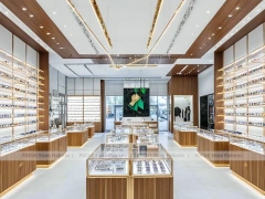 Elegant Woodgrain Eyewear Showroom with Boutique Browsing Aisle