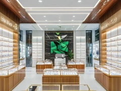 Elegant Woodgrain Eyewear Showroom with Boutique Browsing Aisle