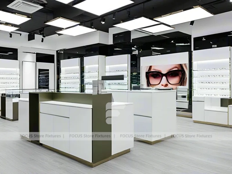 Glossy White Eyewear Boutique Interior with Gold Accent Counter