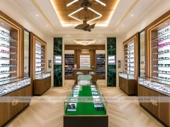 Gold Accent Optical Gallery Interior with Emerald Demo Island