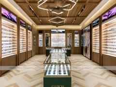Gold Accent Optical Gallery Interior with Emerald Demo Island