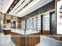 Linear Walnut Eyewear Retail Gallery with Multi-Island Merchandising