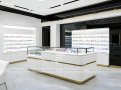 Minimal White Optical Wall Display with Glass Service Island