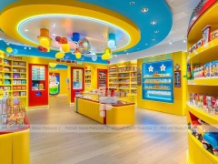Orange Twist Candy Shop Interior with Bright Window Shelving