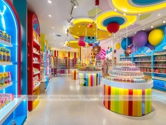 Playful Arcade with Blue Accent Display Walls Candy Family Boutique