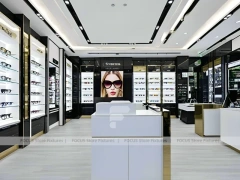 Refined White Optical Wall Display with Open Consultation Zone