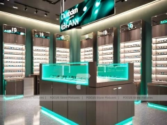 Teal Accent Optical Feature Boutique with Lightbox Wall Display