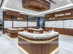 Teal Accent Optical Feature Boutique with Lightbox Wall Display