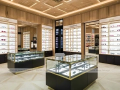 Warm Oak Eyewear Showcase Room with Boutique Centerpiece Counter