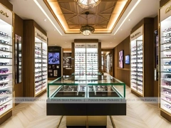 Warm Oak Eyewear Showcase Room with Boutique Centerpiece Counter
