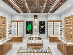 Warm Walnut Vision Store Interior with Symmetrical Display Corridor