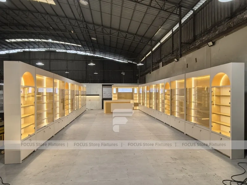 Warm White Perfume Aisle With Arch Shelving