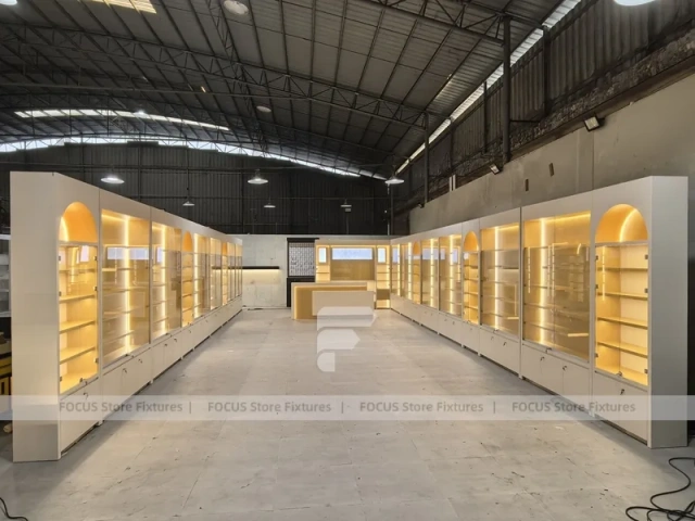 Warm White Perfume Aisle With Arch Shelving